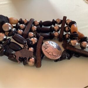 Beaded bracelet with 5  ss charms..Indian and western motif charms..